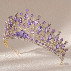Detailed side view of golden bridal crown with purple sapphire crystals and diamonds