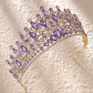 Macro view of gold bridal crown featuring luxury purple amethyst rhinestones and crystals
