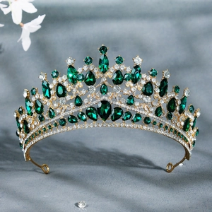 Luxurious gold bridal tiara with emerald green gems and sparkling white zircons