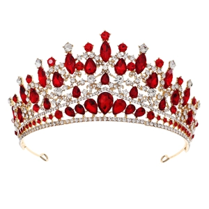 Luxury bridal crown with golden base, sparkling red gemstones and white crystals