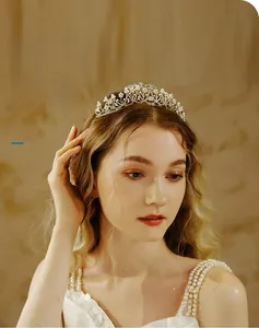 Detailed close-up of bridal flower crown with intricate rhinestones and white pearls