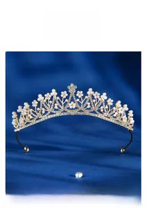 Macro detail of luxury bridal tiara with pearls and rhinestones on gold metal base