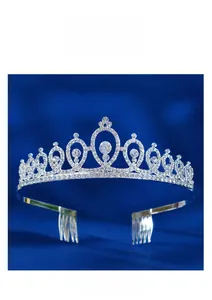 Detailed close-up of a silver bridal crown with shimmering rhinestones on blue velvet