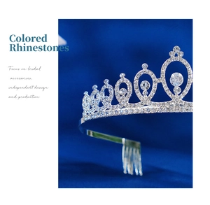Detailed close-up of sparkling rhinestones and silver alloy base on bridal crown comb