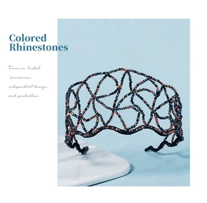 Detail view of woven wavy headband featuring colorful AB rhinestones on black alloy frame