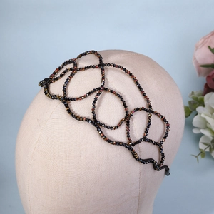 Macro shot of a luxury black AB rhinestone mesh headband on a fashion model display
