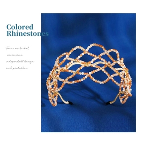 Close-up of handmade woven mesh headband with orange and peach crystal rhinestones