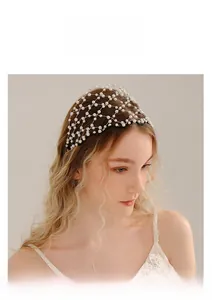 Detail of white pearl woven mesh headband for bridal wedding party accessory