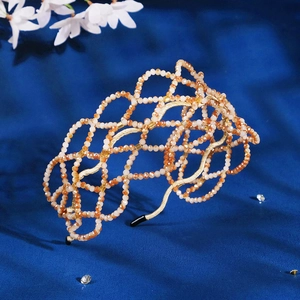 Luxurious handmade orange crystal woven headband with a mesh design and golden frame