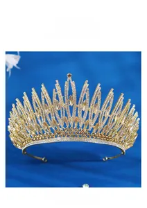 Detailed view of luxury gold bridal tiara with sparkling crystal rhinestones and gems