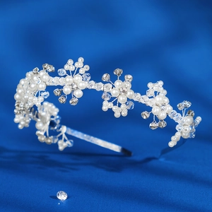 Elegant bridal headband with white pearls and clear crystals in a floral motif design
