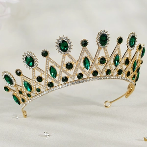 Luxurious vintage gold tiara with emerald green stones and white crystal embellishments