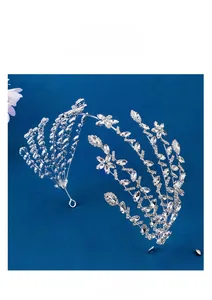 Detailed view of silver bridal tiara with rhinestones and crystal flower petals