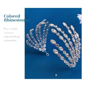 Macro detail of silver bridal headband featuring radiant rhinestone patterns and fixing loops