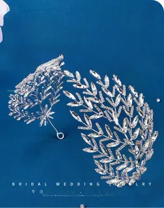 Macro detail of bridal leaf headband with sparkling marquise rhinestones and silver metal