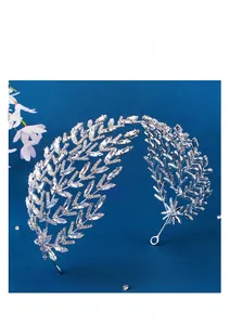 Detailed close-up of luxury bridal headband with sparkling silver crystal leaf motifs