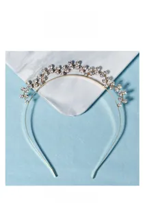 Detail of elegant gold rhinestone headband with floral crystal patterns for weddings