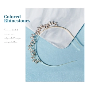 Detailed close-up of a golden headband featuring meticulously set sparkling rhinestones