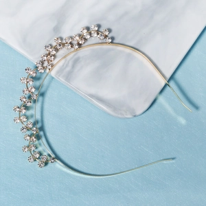 Elegant gold metal headband with sparkling white rhinestones in a vine floral design