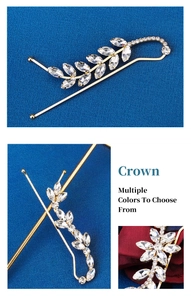 Detailed macro view of rhinestone leaf hair clip with gold metal base and marquise gems