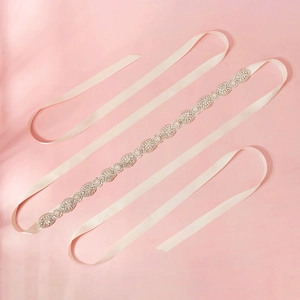 Elegant bridal belt with sparkling rhinestones and white pearls on ivory satin ribbon