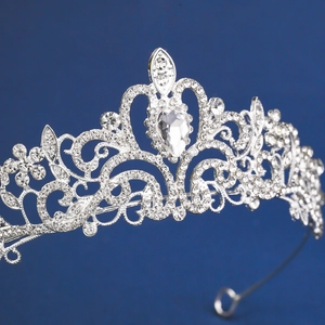 Close-up of bridal crown featuring heart-shaped patterns and pear-cut crystal details
