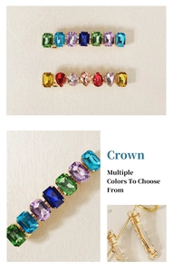 Detail showing colorful rhinestones and metal spring clip structure on the hair pin