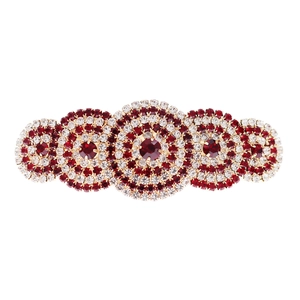 Elegant red and white crystal hair clip with gold base in a vintage symmetrical design