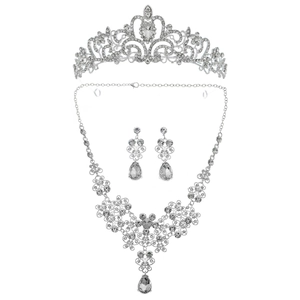 Luxurious bridal jewelry set with silver crown necklace and drop earrings in white crystals