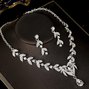 Detailed macro view of silver bridal jewelry set with sparkling zircon crystals