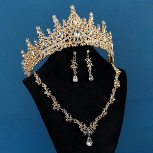 Close-up of luxury bridal tiara set with gold alloy and water-drop crystal pendants