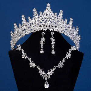 Detailed view of silver bridal jewelry set with sparkling crystals and teardrop pendants