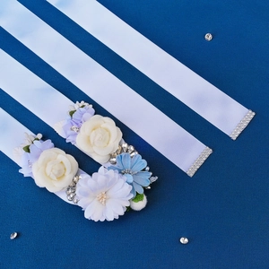 Detail of handmade bridal belt featuring 3D fabric flowers, rhinestones and silk ribbons