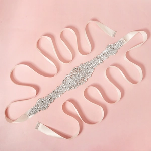 Elegant bridal wedding belt with sparkling crystals on a cream satin ribbon decoration
