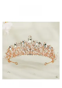 Close-up of handmade rose gold bridal crown with marquise-cut crystals and sparkling rhinestones