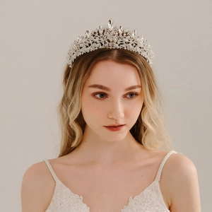 Elegant bridal crystal tiara with silver rhinestones on model for wedding hair accessories