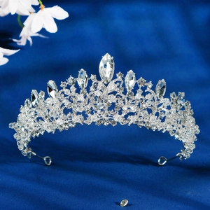Elegant bridal tiara with sparkling crystals and silver alloy base on blue velvet