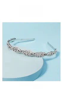 Detail of silver bridal leaf headband with sparkling rhinestones on a display stand