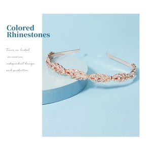 Close-up of rose gold rhinestone headband with elegant leaf design for bridal hair styling