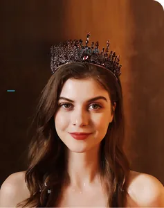 Detailed close-up of a vintage baroque bridal tiara with dark rhinestones on a female model
