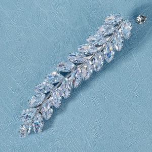 Macro shot of silver wheat leaf hair clip with marquise cut sparkling zircons