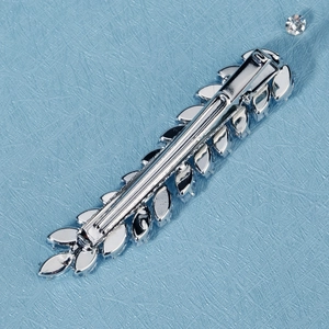 Close-up of the silver wheat leaf hair clip showing the sturdy metal spring clasp