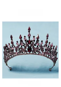 Detailed view of vintage baroque crown with deep red rhinestones and bronze metal