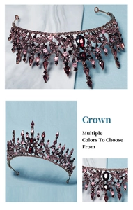 Close-up of vintage Baroque crown with dark red rhinestones on bronze metal frame
