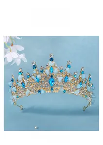 Detailed macro view of the gold alloy bridal crown with blue crystal stones and rhinestones