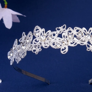 Detail of silver butterfly headband with hollow weave design and sparkling crystals