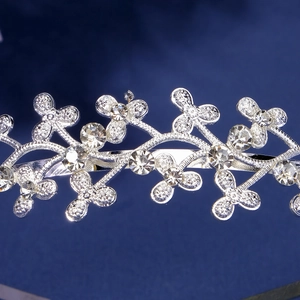 Close-up of silver-toned floral headband with crystal vine details and sparkling rhinestones
