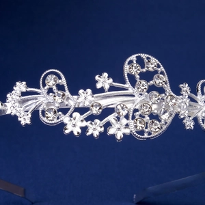 Detailed macro view of silver floral headband featuring intricate rhinestone inlay