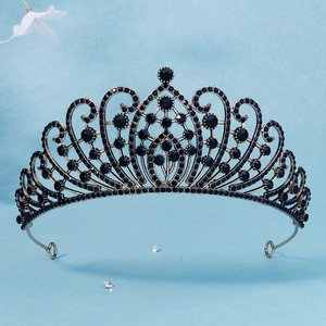 Close-up of vintage bridal tiara with black rhinestones on antique bronze metal