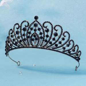 Detail of baroque crown showing antique gold metalwork and inlaid black rhinestones
